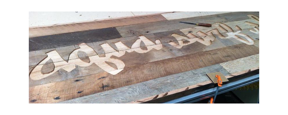 rustic reclaimed wood engraved sign